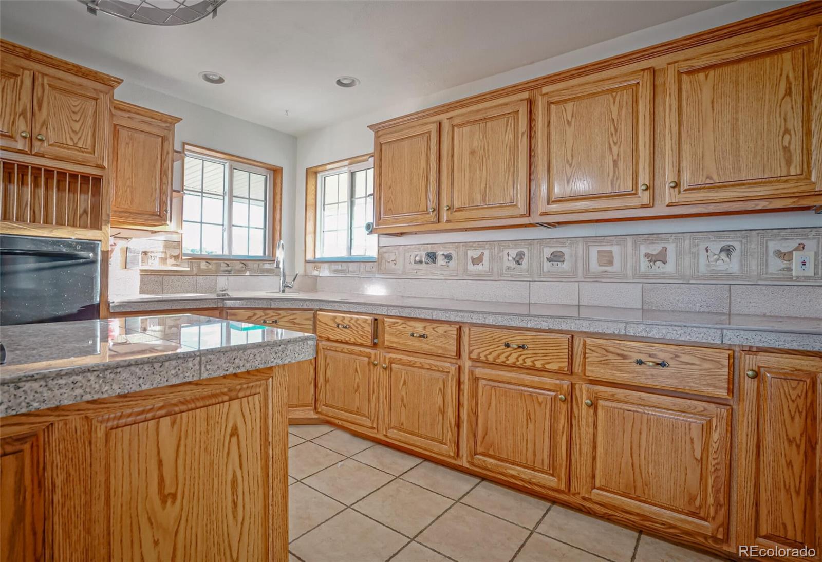 20722 Tollerburg Road Trinidad, CO 81082 - Photo 12 of 31 a kitchen with stainless steel appliances granite countertop a sink dishwasher stove and cabinets with wooden floor