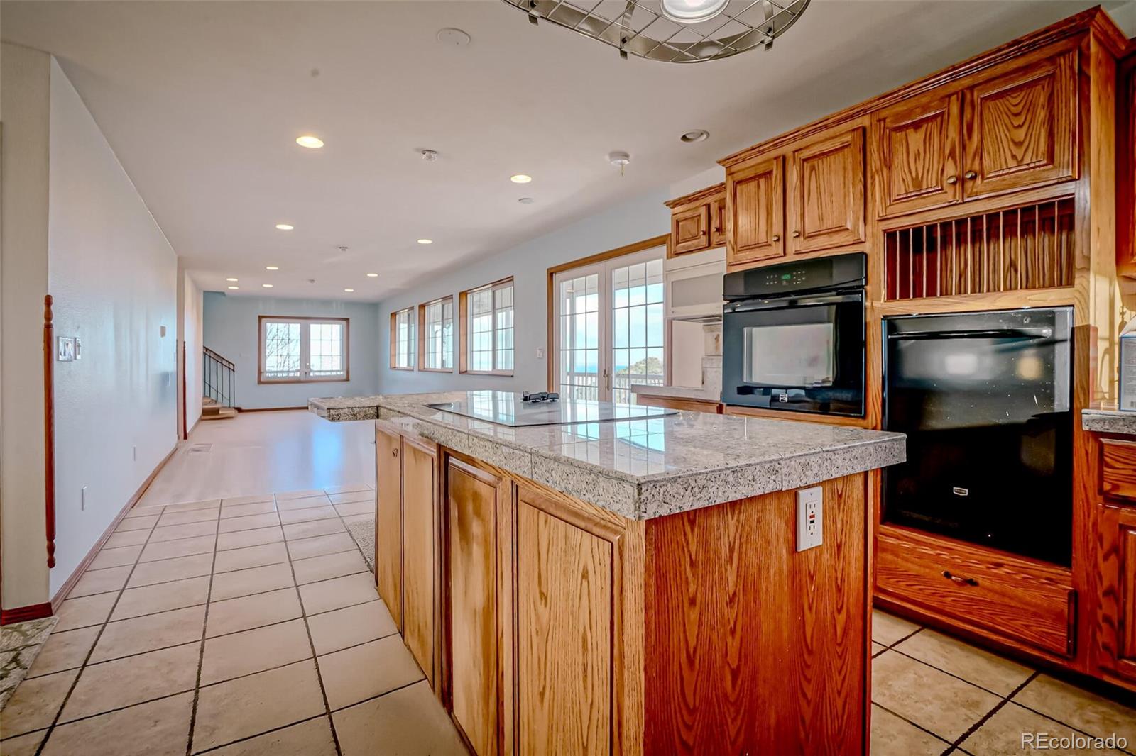 20722 Tollerburg Road Trinidad, CO 81082 - Photo 13 of 31 a kitchen with stainless steel appliances granite countertop a refrigerator and a stove