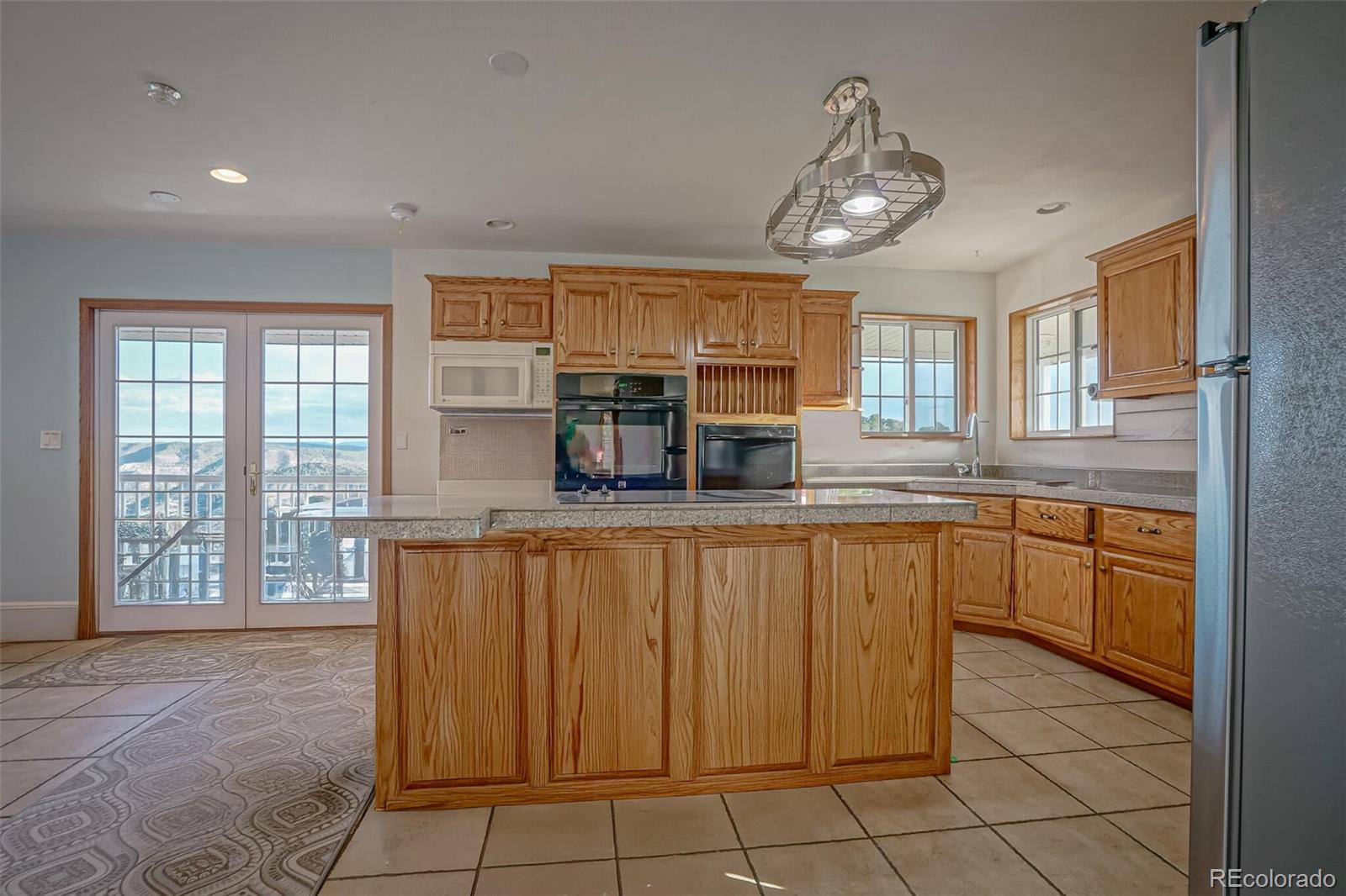 20722 Tollerburg Road Trinidad, CO 81082 - Photo 14 of 31 a kitchen with stainless steel appliances granite countertop a refrigerator and a sink