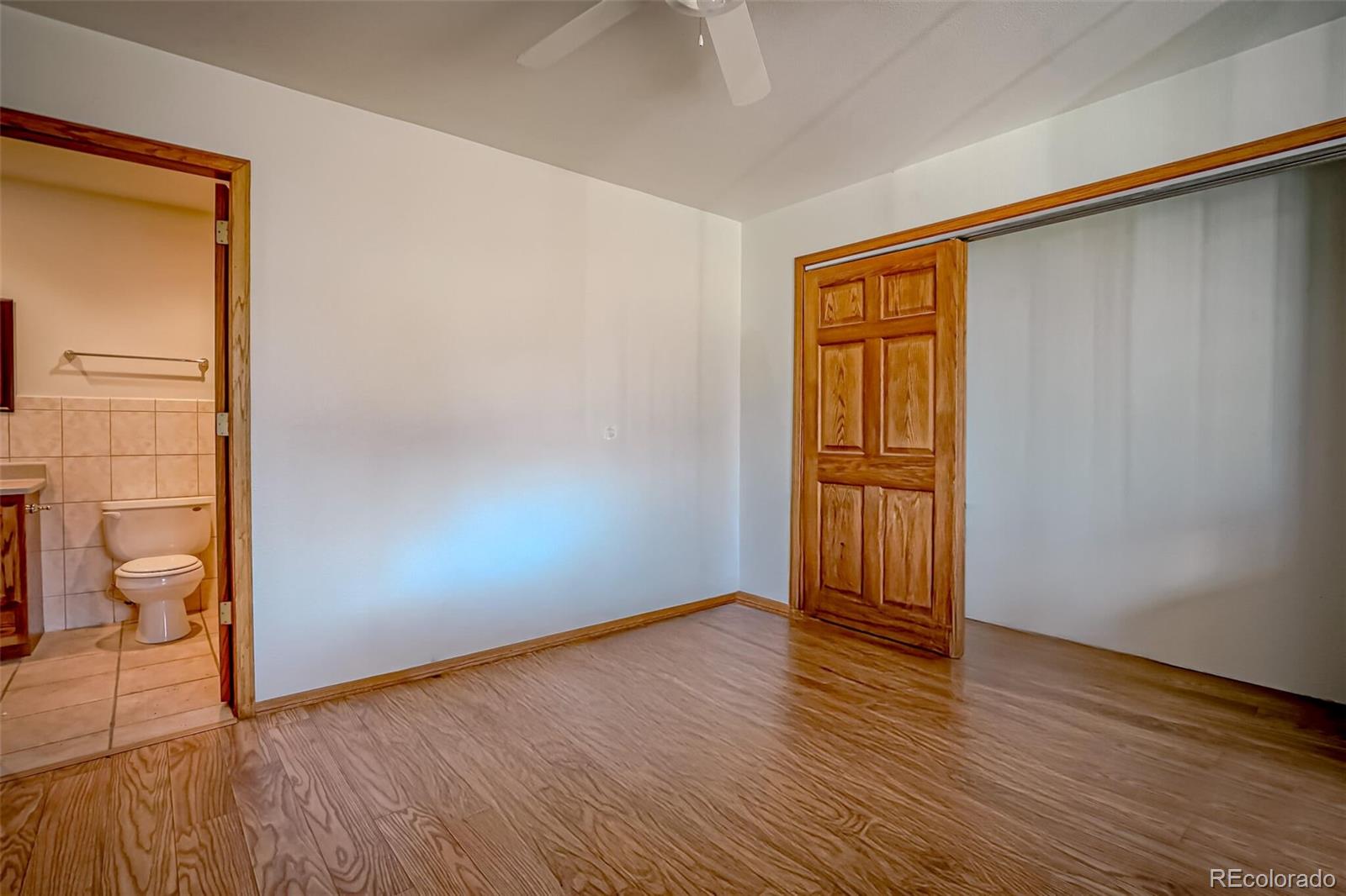 20722 Tollerburg Road Trinidad, CO 81082 - Photo 18 of 31 a view of an empty room with wooden floor and a window