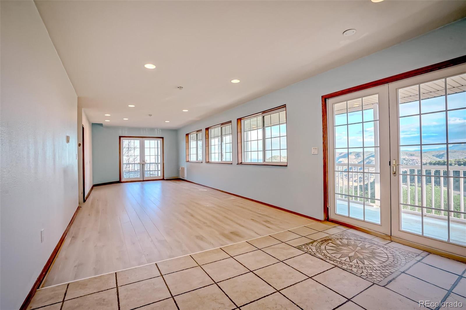 20722 Tollerburg Road Trinidad, CO 81082 - Photo 22 of 31 a view of an empty room with window and wooden floor