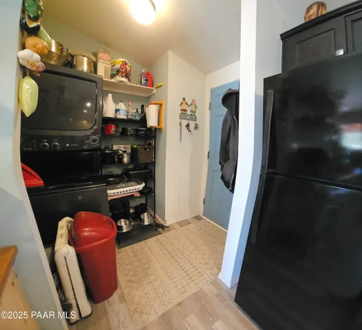a view of a patio with table and chairs and potted plants