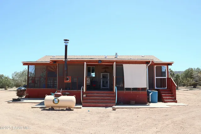 a house view with a outdoor seating space