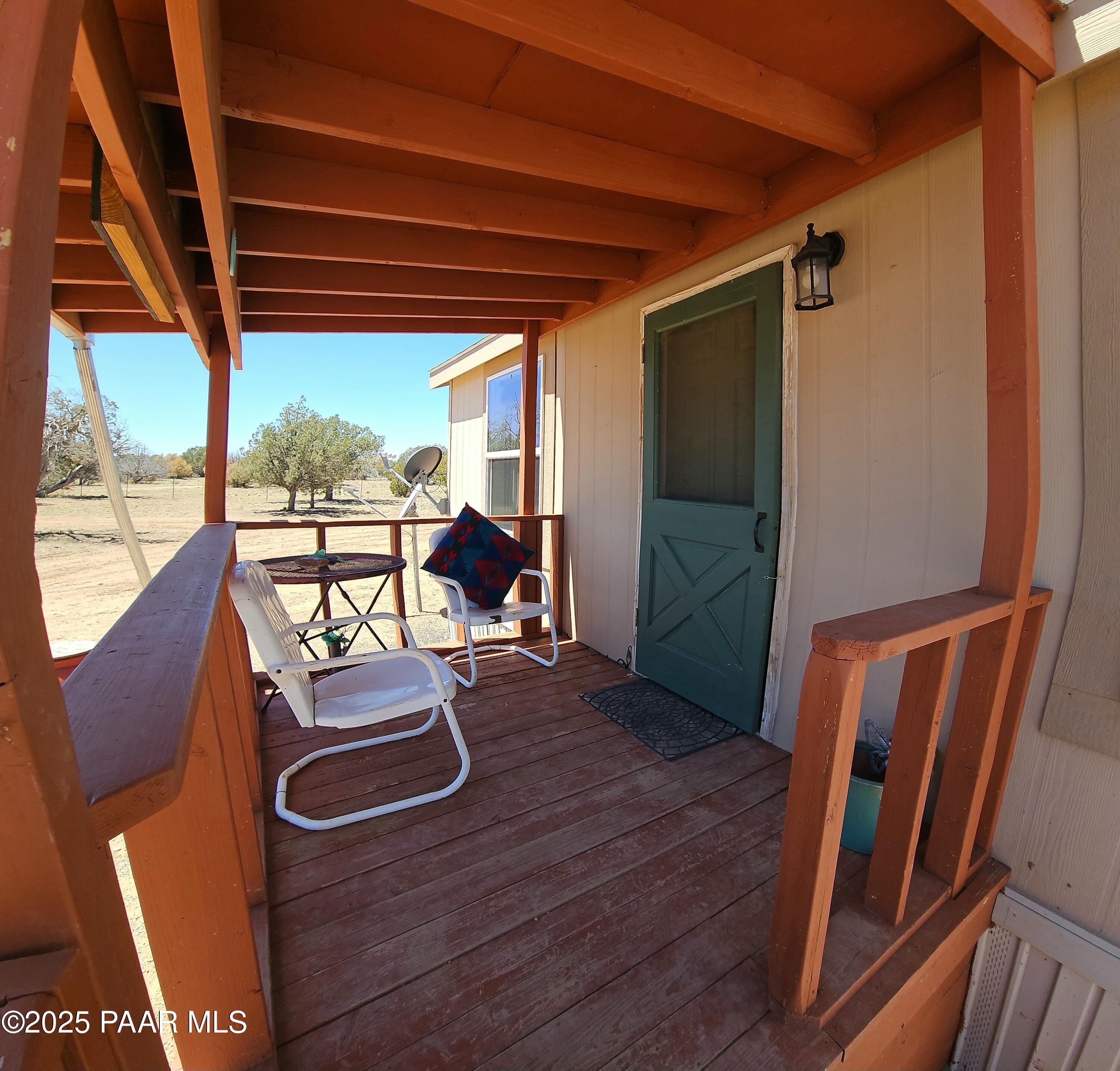 8850 West Fountain Ranch Road Ash Fork, AZ 86320 - Photo 2 of 29 a view of a room with wooden floor and furniture