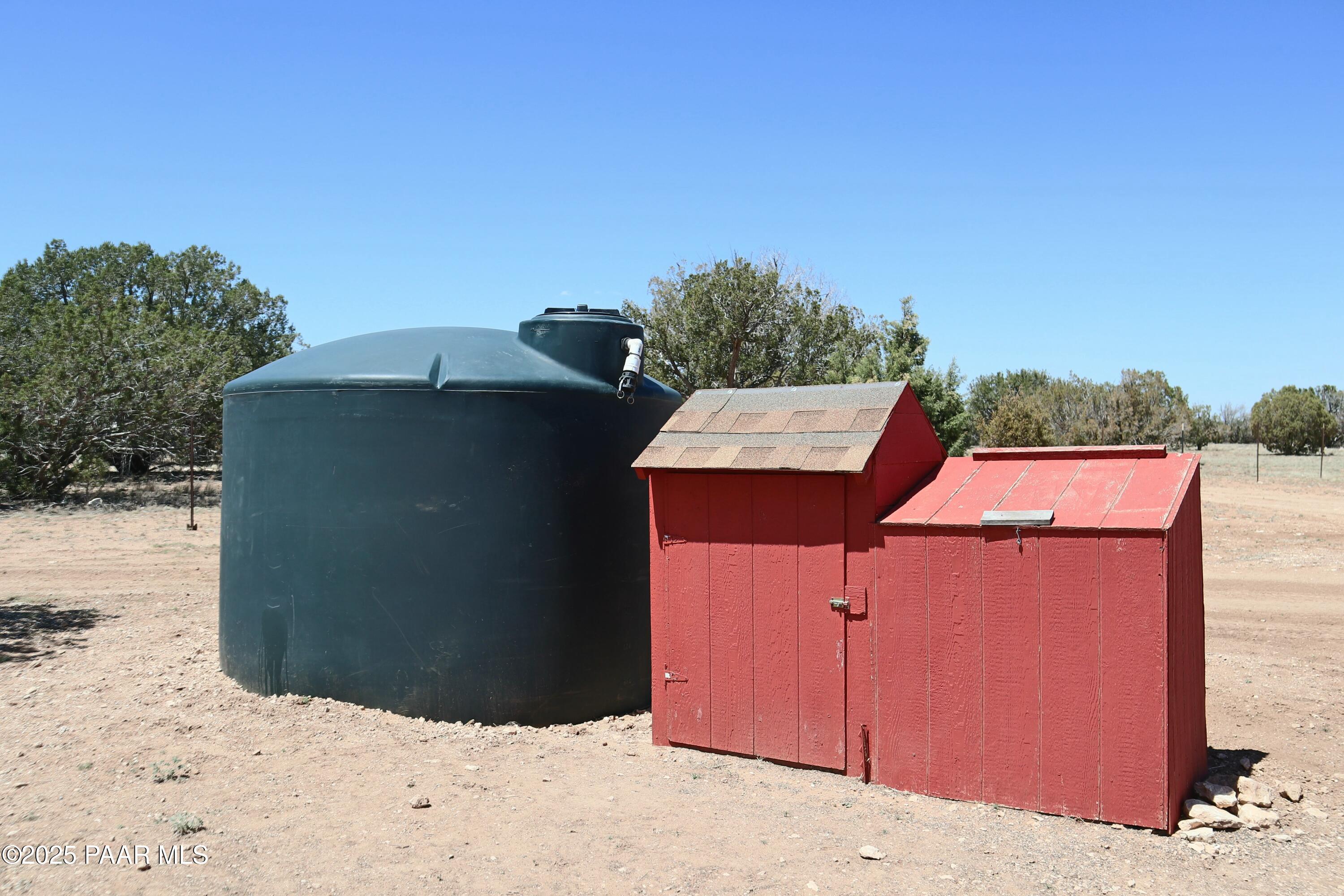 8850 West Fountain Ranch Road Ash Fork, AZ 86320 - Photo 24 of 29 a backyard of a house with yard and mountain view in the back