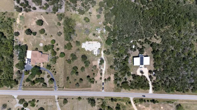 a bathroom with a shower and a sink