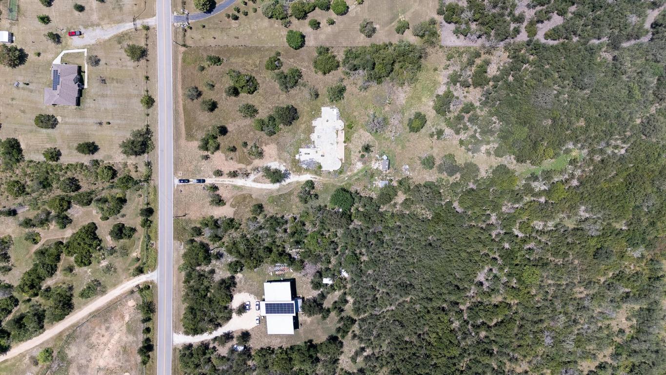 7693 Nez Perce Trace Manor, TX 78653 - Photo 4 of 12 view of a house with a trees