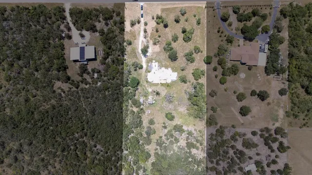 an aerial view of house with yard
