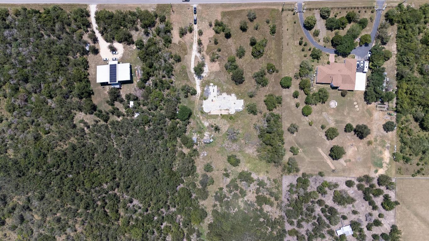 7693 Nez Perce Trace Manor, TX 78653 - Photo 6 of 12 an aerial view of house with yard
