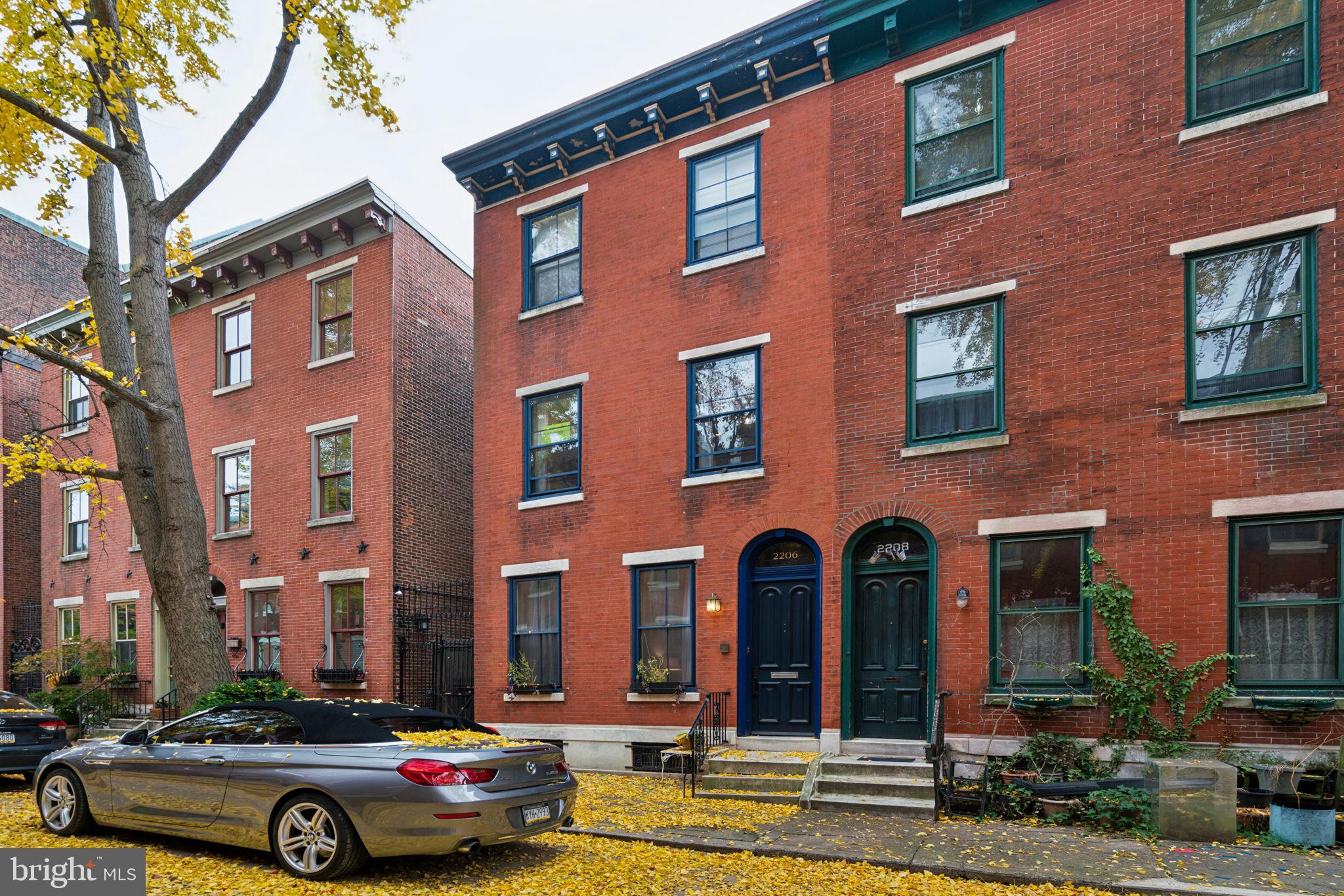 a car parked in front of brick building