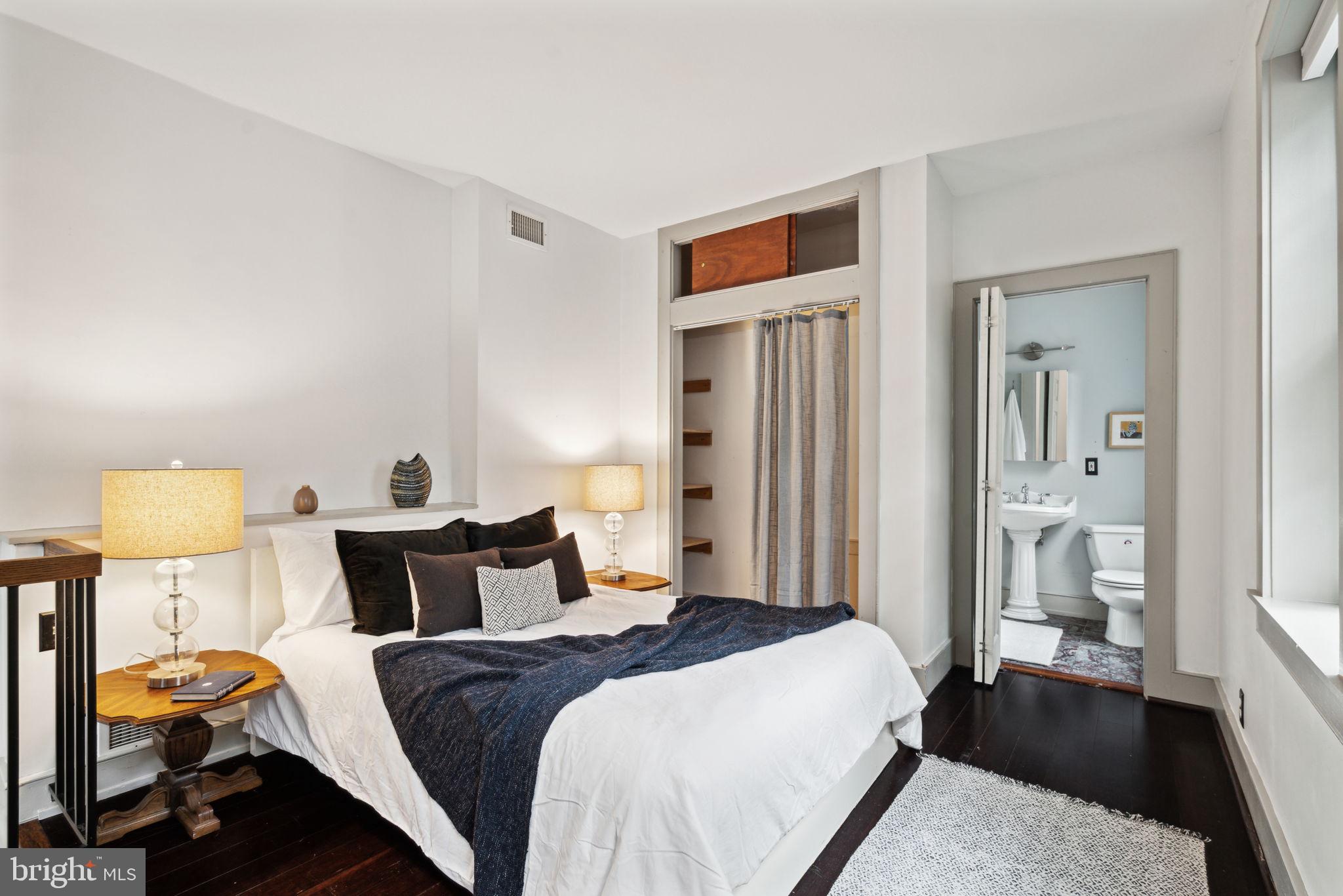 2206 Wallace Street Philadelphia, PA 19130 - Photo 11 of 38 a bedroom with a bed and wooden floor
