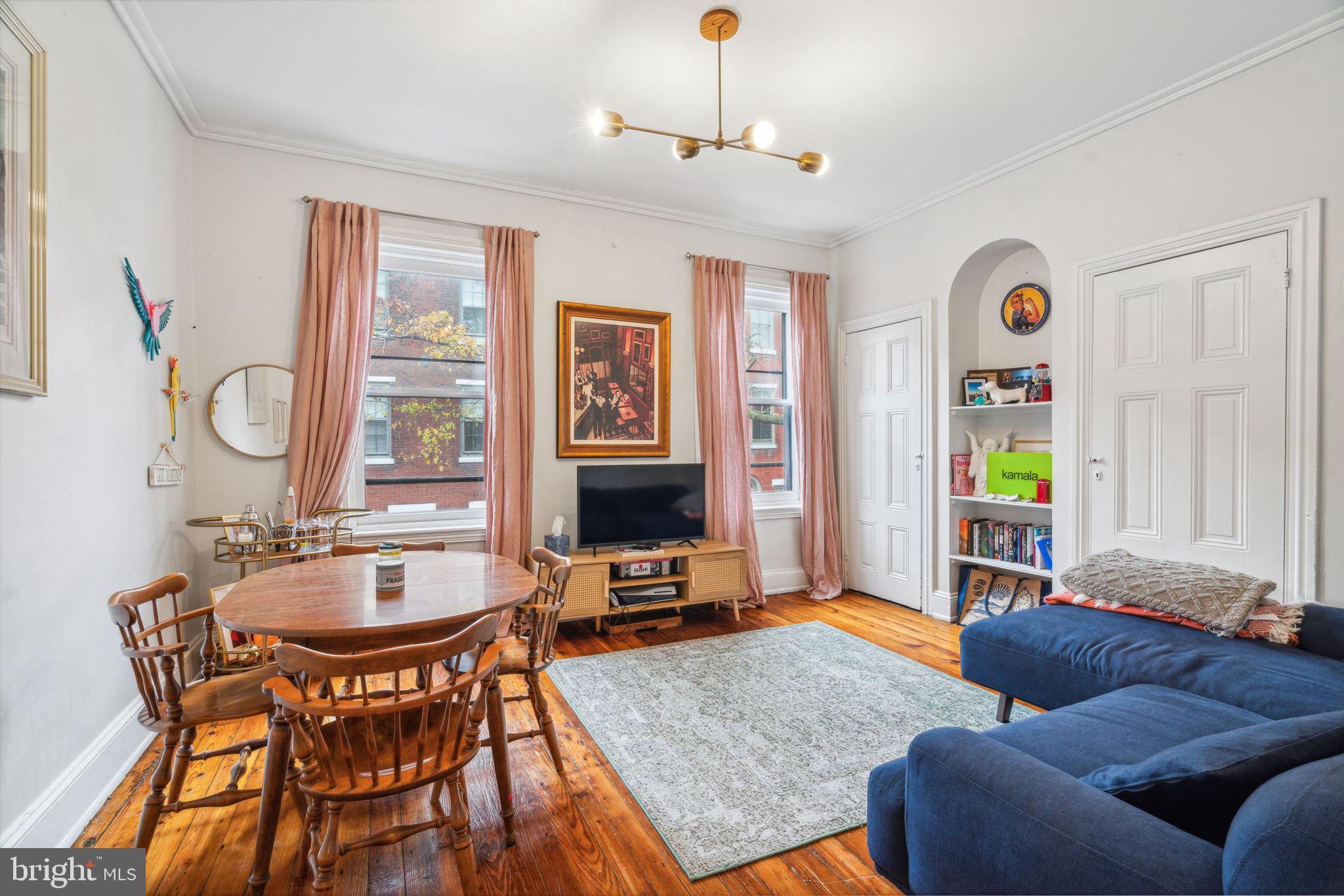 2206 Wallace Street Philadelphia, PA 19130 - Photo 23 of 38 a living room with furniture a rug and a window