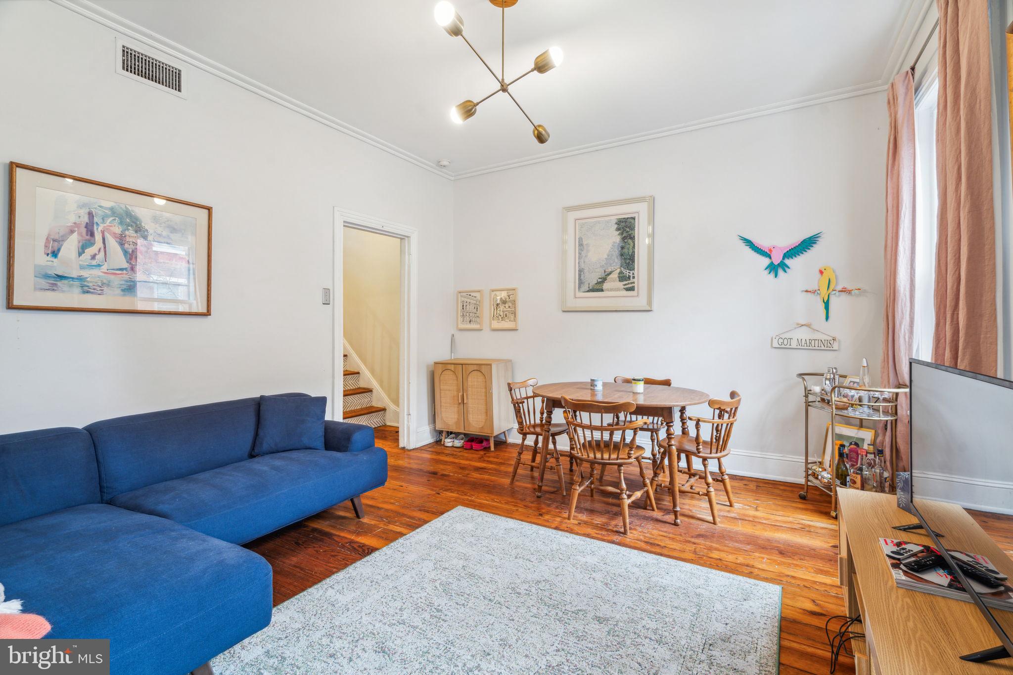 2206 Wallace Street Philadelphia, PA 19130 - Photo 24 of 38 a living room with furniture kitchen view and a large window