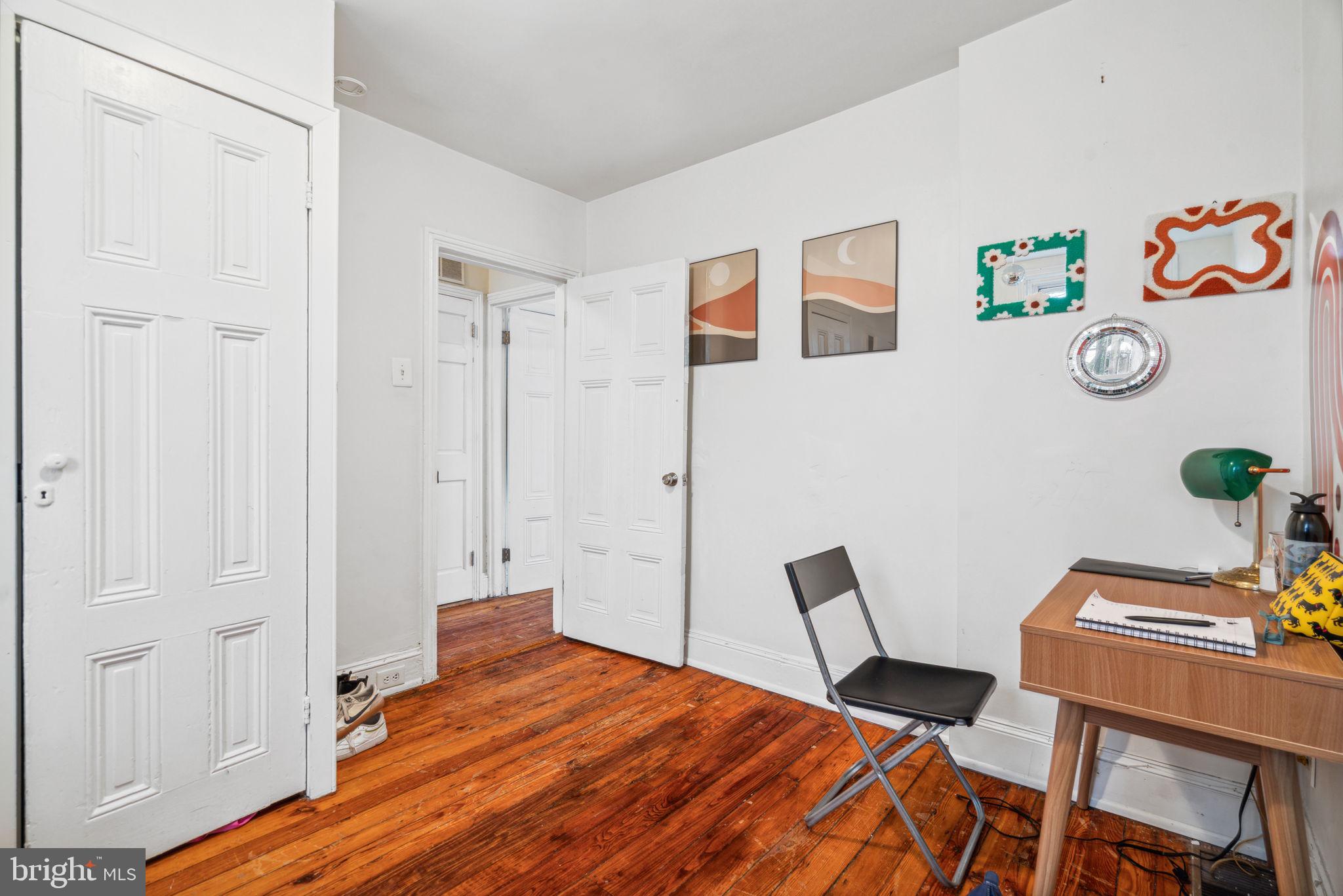 2206 Wallace Street Philadelphia, PA 19130 - Photo 31 of 38 a bedroom with a bed and a table in it