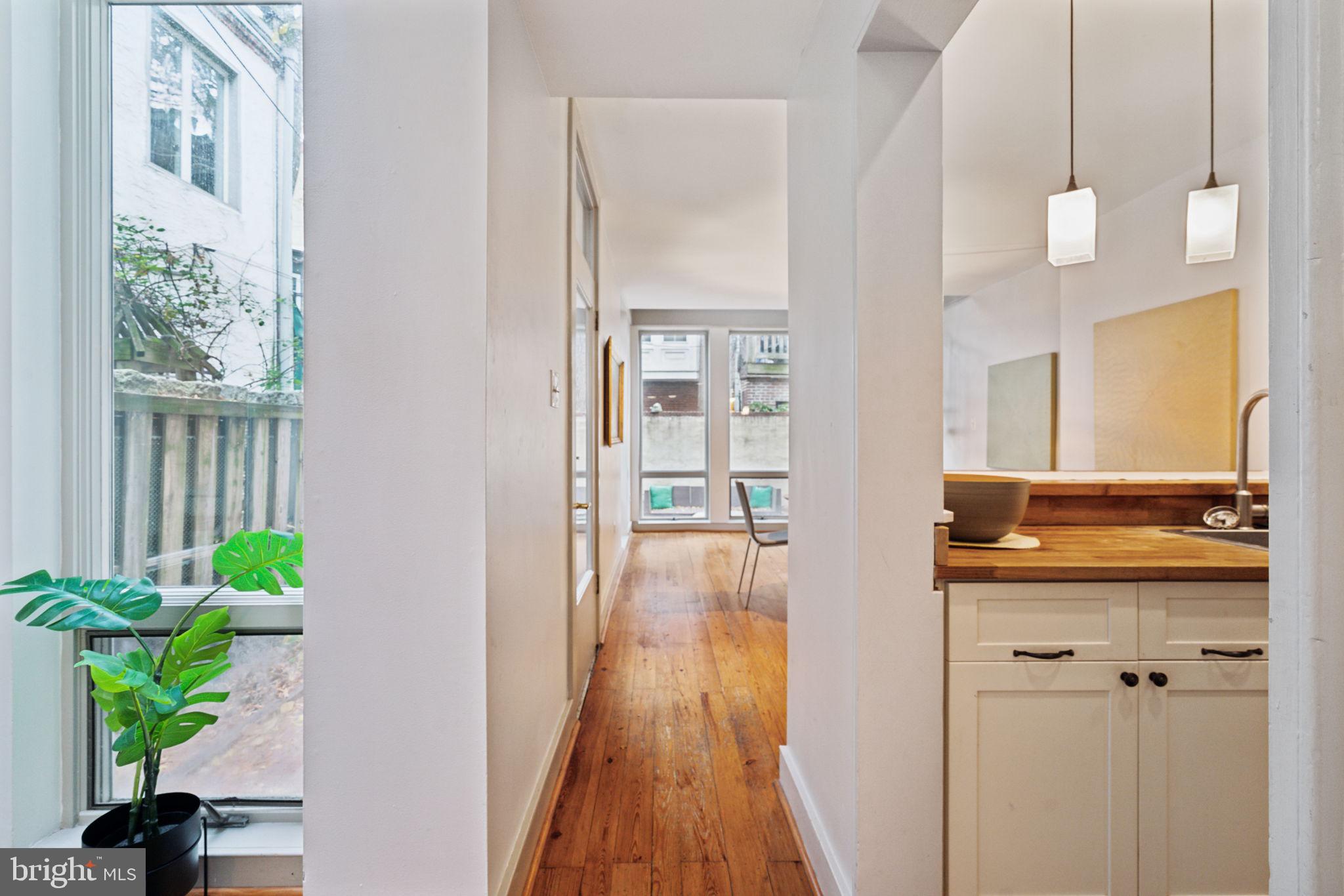 2206 Wallace Street Philadelphia, PA 19130 - Photo 4 of 38 a view of a hallway view with wooden floor and staircase