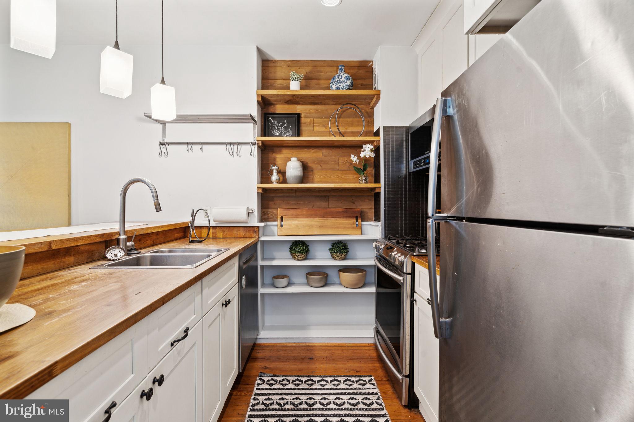 2206 Wallace Street Philadelphia, PA 19130 - Photo 6 of 38 a kitchen with a refrigerator and a sink
