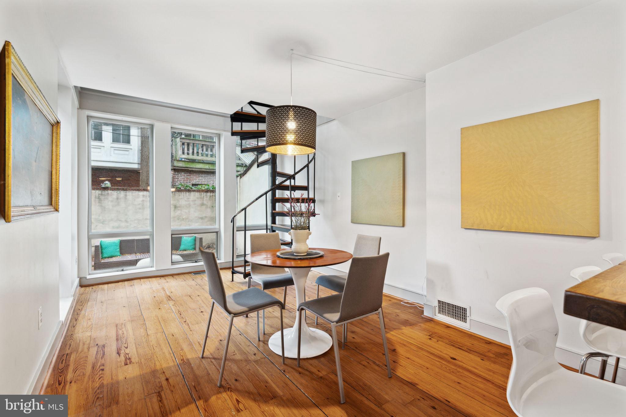2206 Wallace Street Philadelphia, PA 19130 - Photo 8 of 38 a view of a dining room with furniture and wooden floor