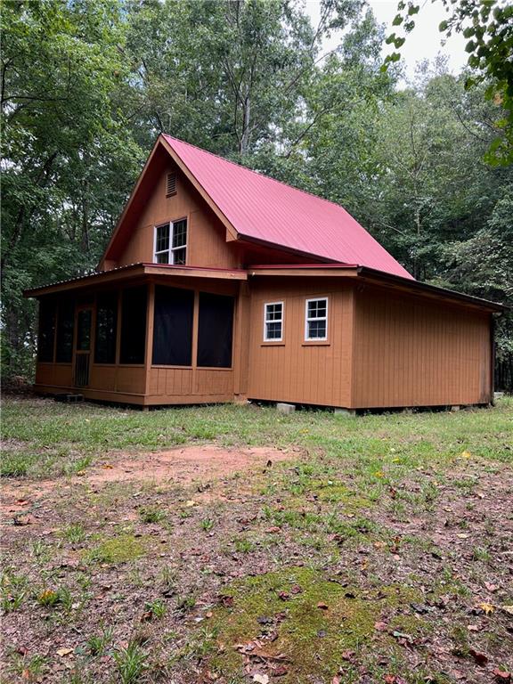 425 Herrin Road Cornelia, GA 30531 - Photo 1 of 1 Front View of this quaint rustic cabin.