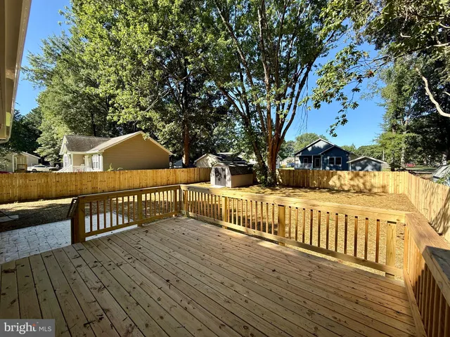 a view of yard covered with snow in front of house
