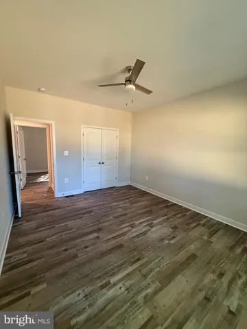 a bathroom with a toilet and bathtub