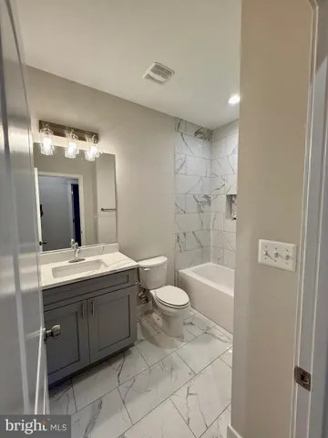 a view of a house with a door and wooden floor