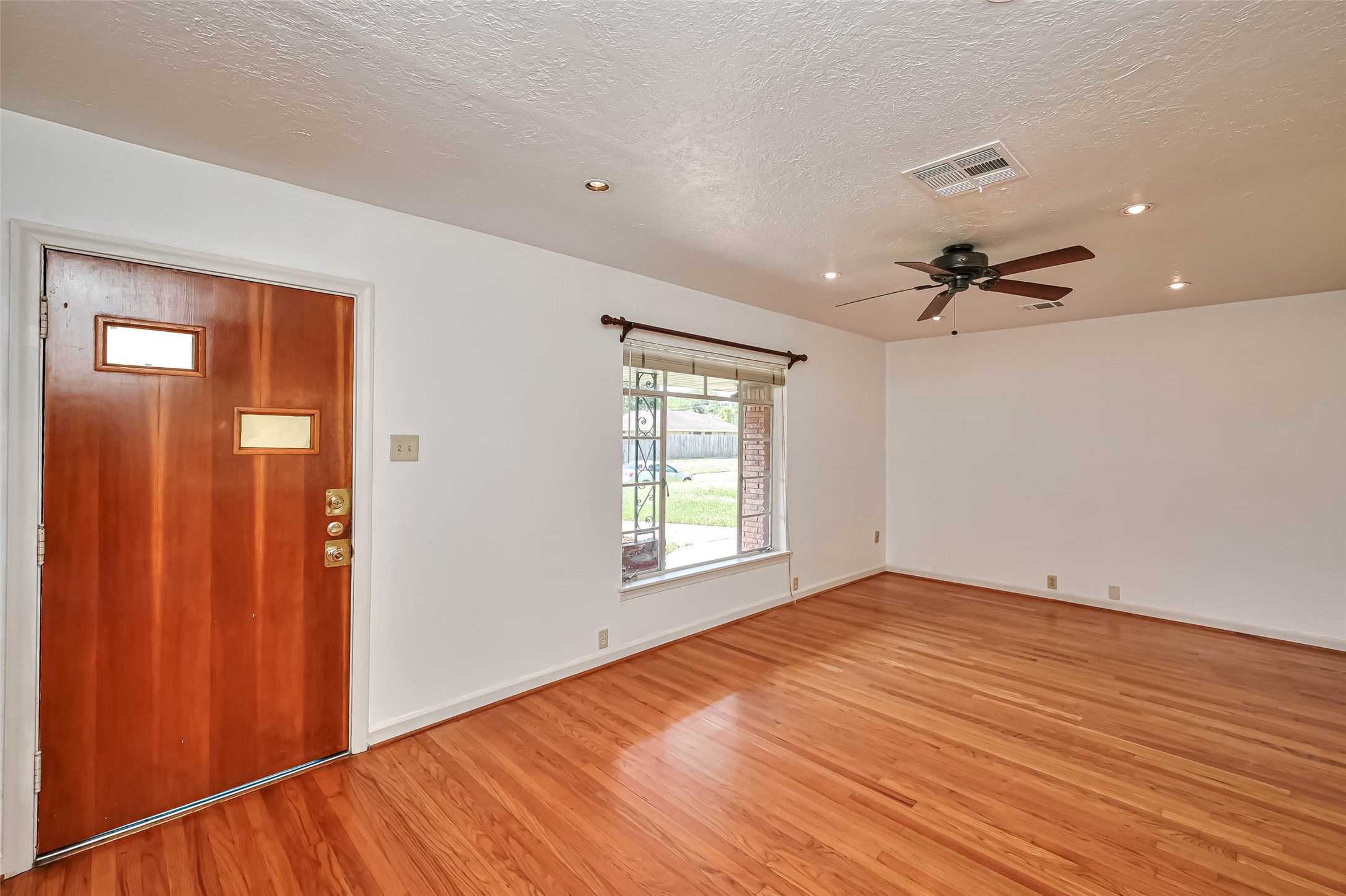 3018 Attridge Road Houston, TX 77018 - Photo 13 of 29 a view of empty room with wooden floor and fan