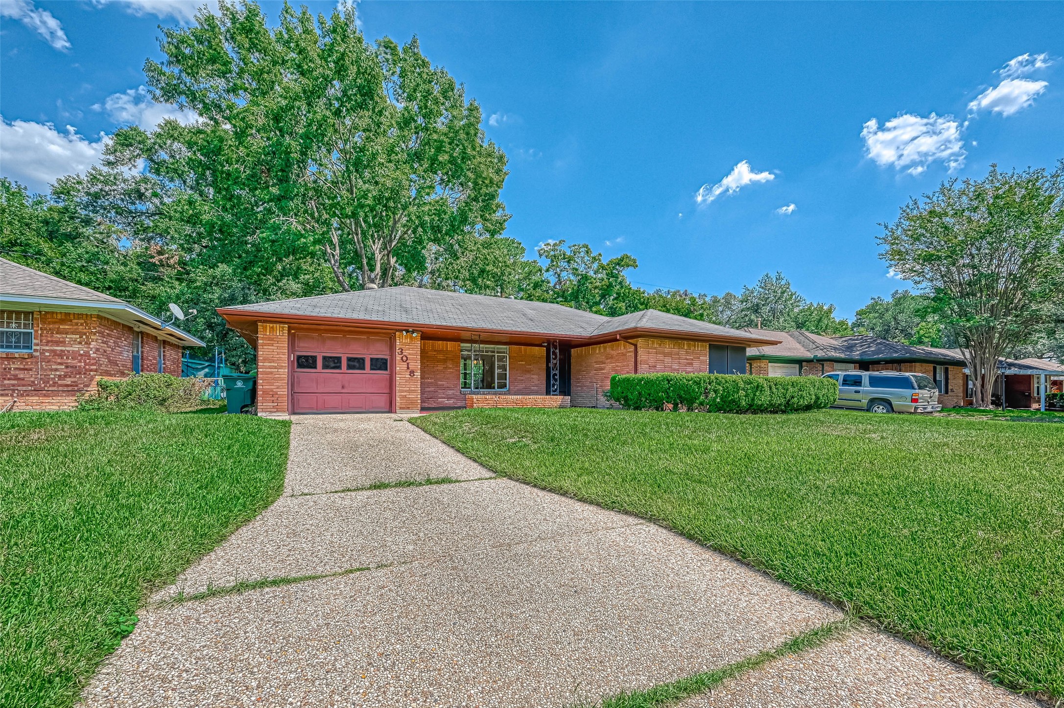 3018 Attridge Road Houston, TX 77018 - Photo 16 of 29 a front view of a house with a yard and trees