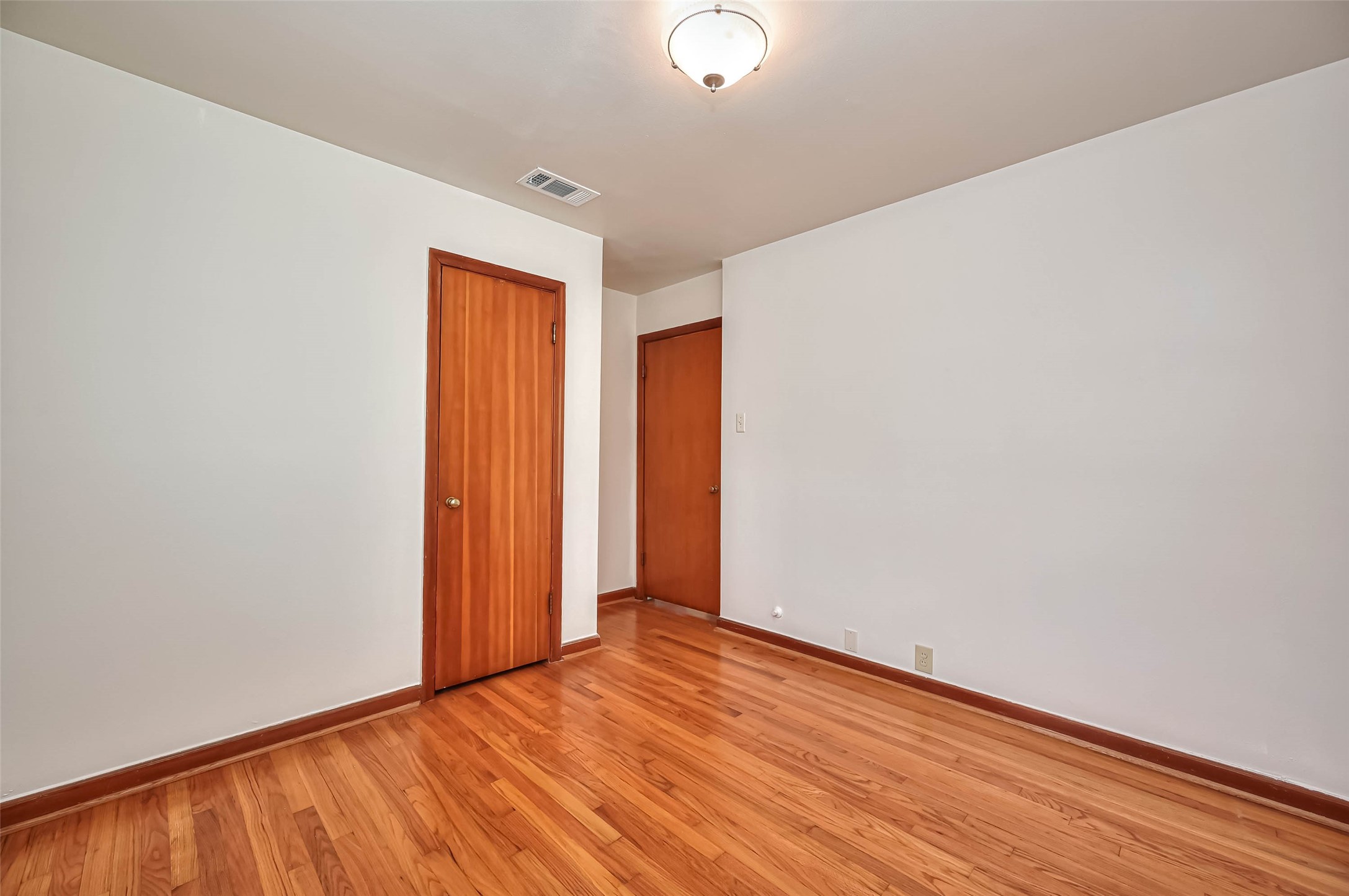 3018 Attridge Road Houston, TX 77018 - Photo 23 of 29 a view of an empty room with wooden floor