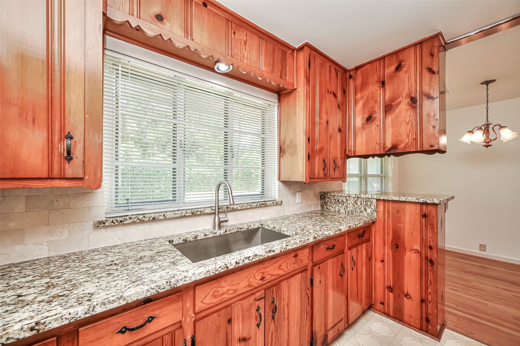 3018 Attridge Road Houston, TX 77018 - Photo 5 of 29 a kitchen with stainless steel appliances granite countertop a sink a stove and a wooden cabinets