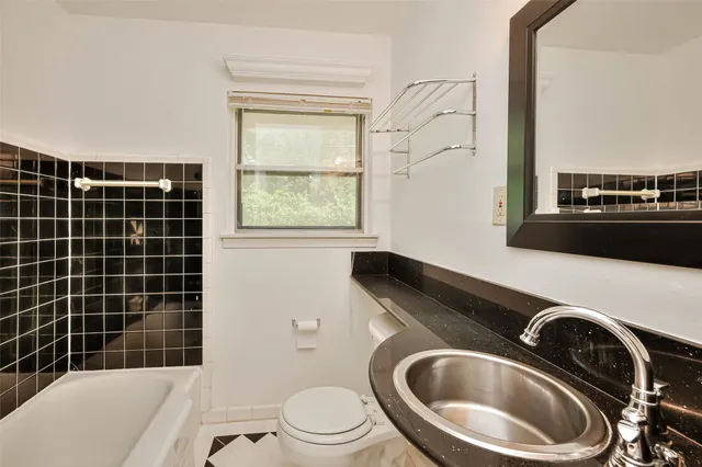 a kitchen with a stove and a sink