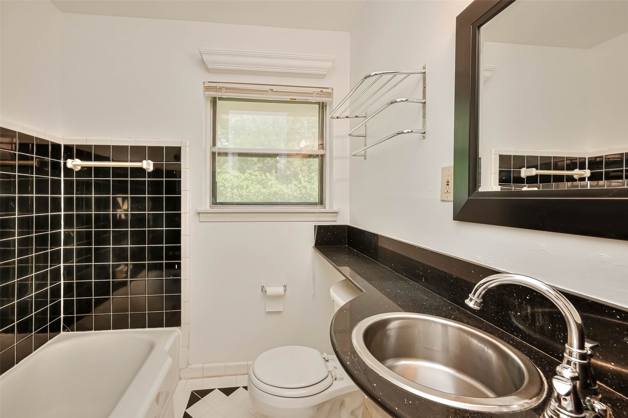 3018 Attridge Road Houston, TX 77018 - Photo 6 of 29 a bathroom with a sink a toilet and shower