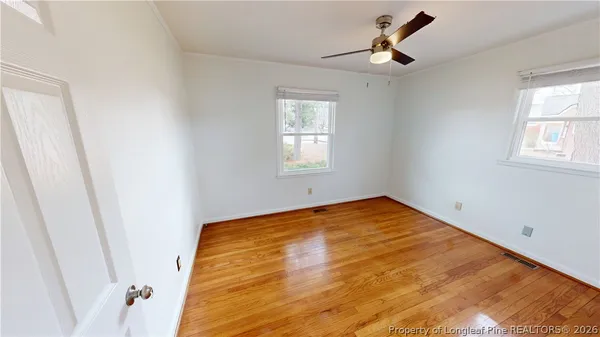 a view of empty room with windows