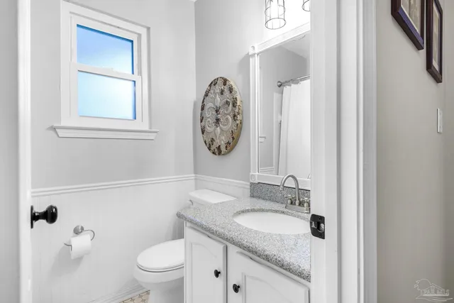 a bedroom with furniture and wooden floor