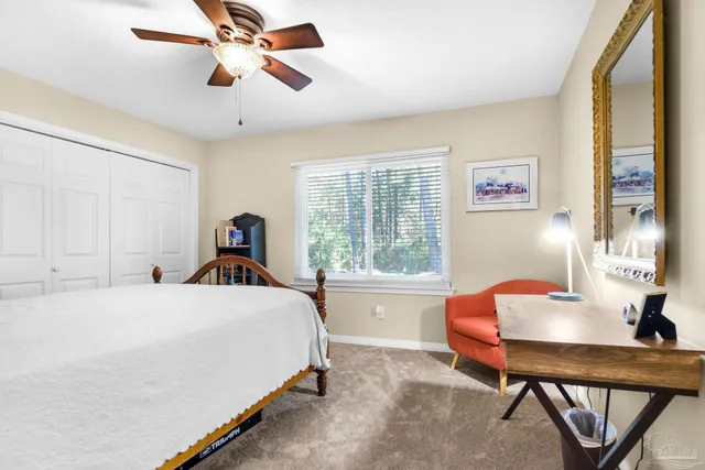 a bed room with a bed and a chandelier