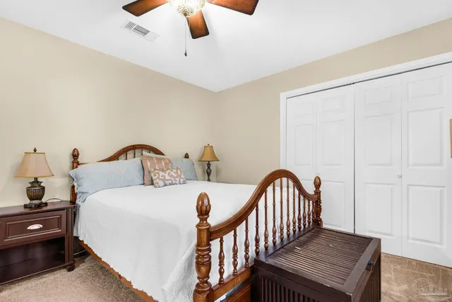 a bedroom with furniture and a window