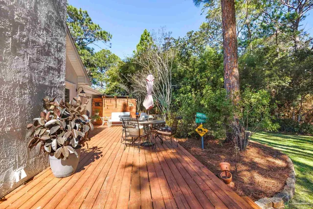 an aerial view of residential houses with outdoor space and street view
