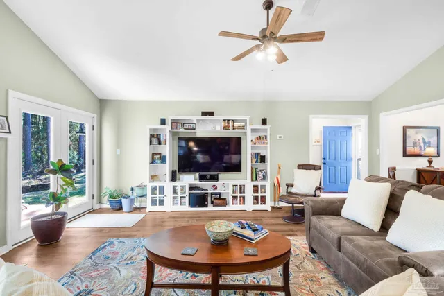 a kitchen with white cabinets and appliances