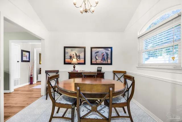 a kitchen with stainless steel appliances granite countertop a sink a window and cabinets