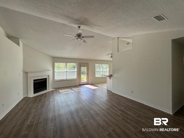 181 Pemberton Loop Fairhope, AL 36532 - Photo 3 of 12 Unfurnished living room featuring a fireplace with flush hearth, dark wood finished floors, and ceiling fan