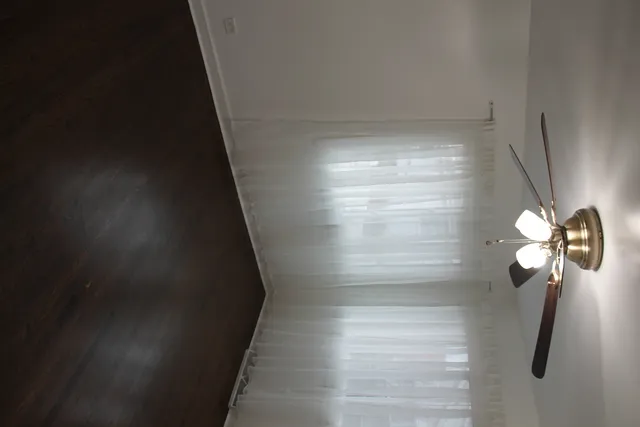 an empty room with a empty space and windows