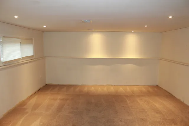 a white toilet sitting next to a bathroom sink