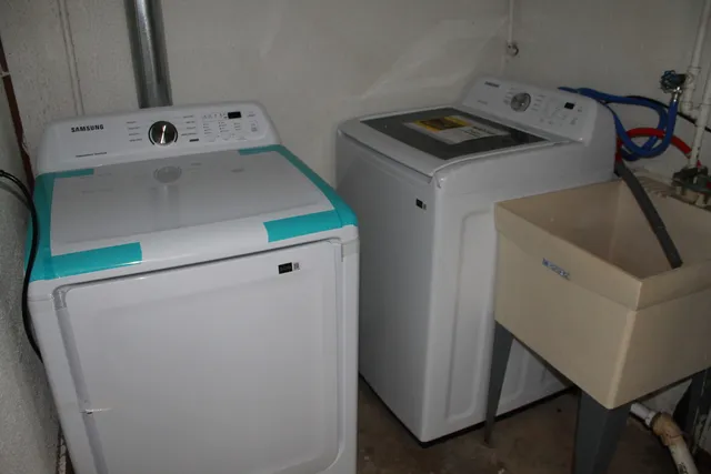 a view of a backyard with sitting area