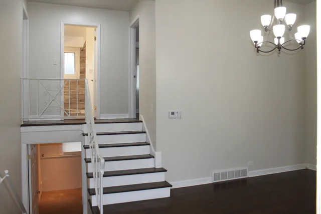 a view of entryway with wooden floor