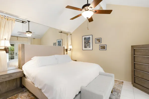 a large white bed in a white room