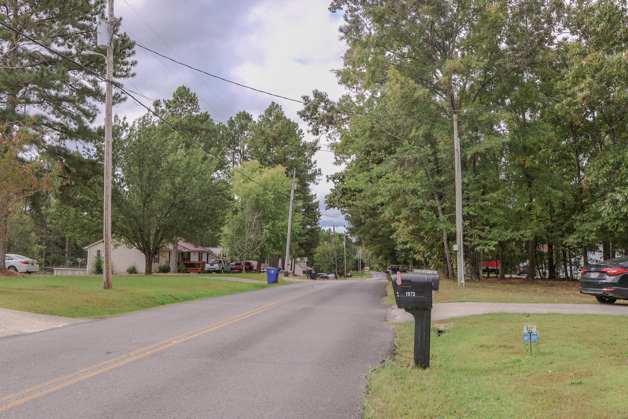 1972 Southeast Hunt Road Cleveland, TN 37323 - Photo 24 of 25 a street sign on a sidewalk next to a road
