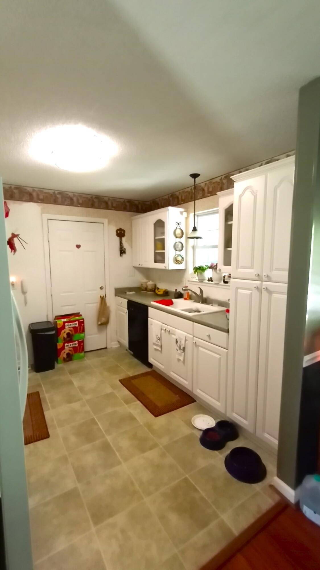 1972 Southeast Hunt Road Cleveland, TN 37323 - Photo 7 of 25 a kitchen with a refrigerator and white cabinets