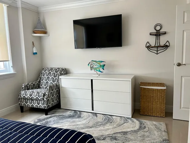 a living room with a couch and a flat screen tv