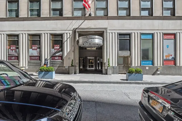 a view of a brick house with many windows