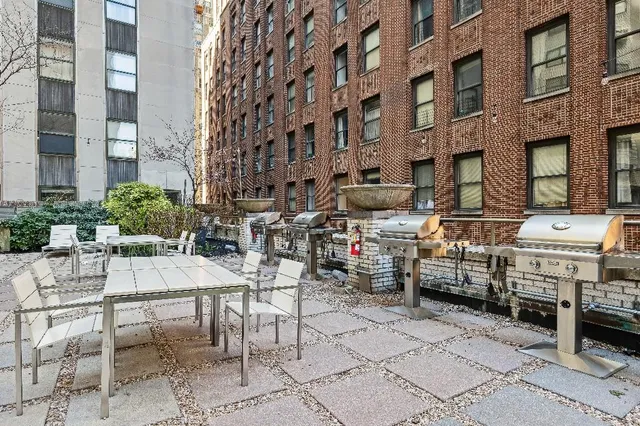 a view of a building with sitting area