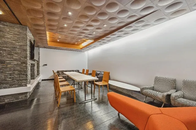 a reading room with furniture and wooden floor